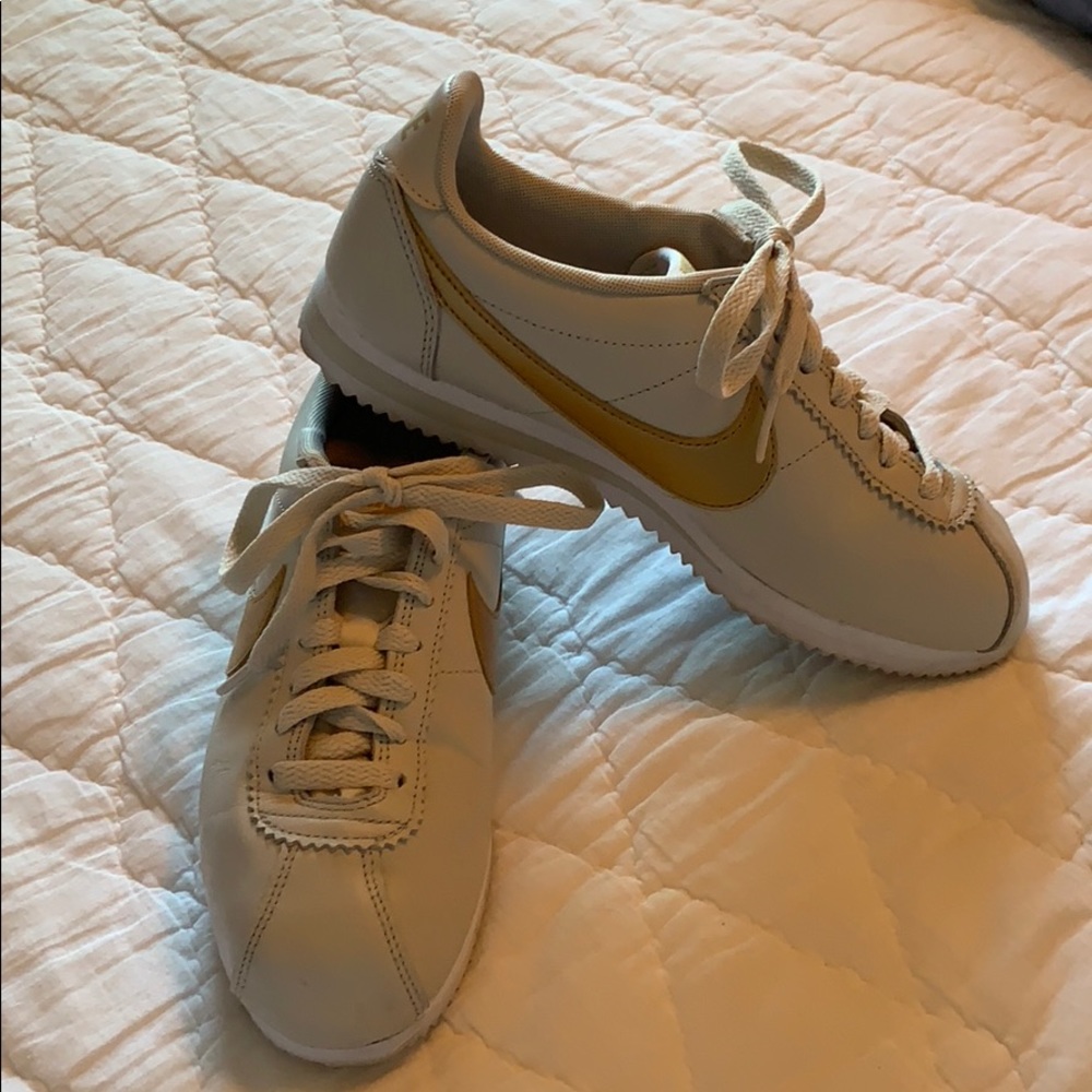 Nike Cortez gold and bone white sneakers